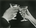 man and woman toasting