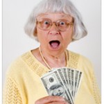 older woman holding cash